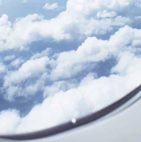 view out of aeroplane window of clouds