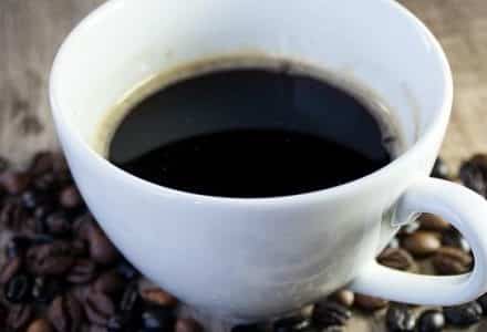 coffee mug with coffee grains